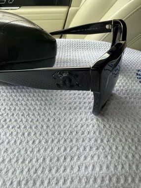 CHANEL Black Sunglasses with Silver Logo Accent